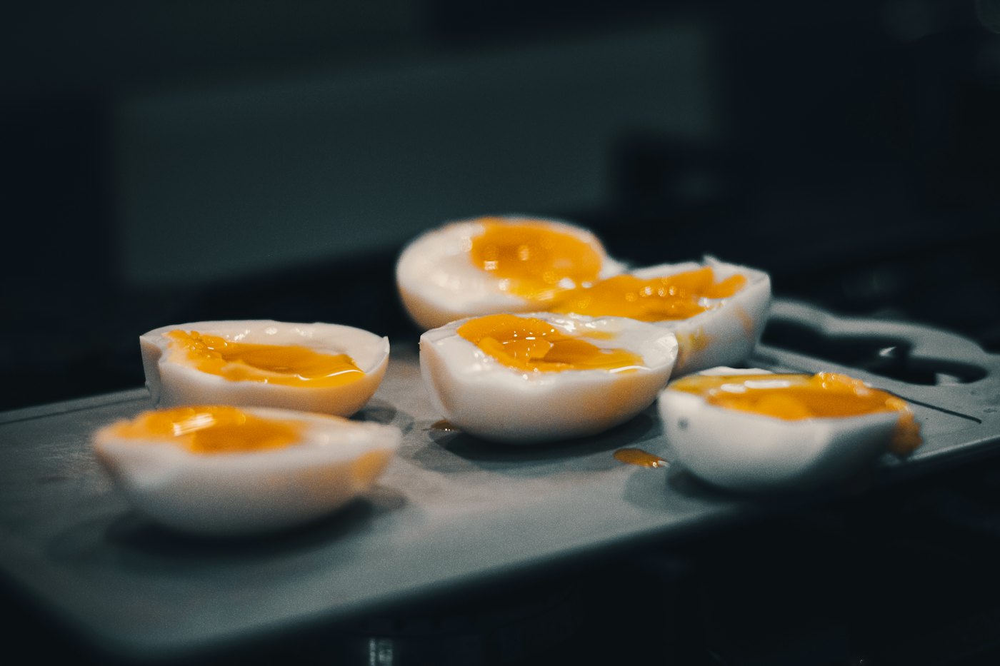 Cooked egg halves arranged on a tray