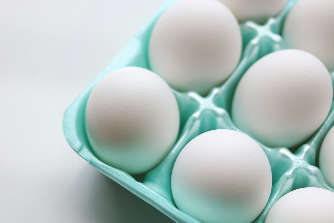 Clean white eggs in a moulded tray at receival